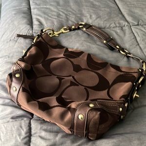 Nice Coach purse. Gold metal accents